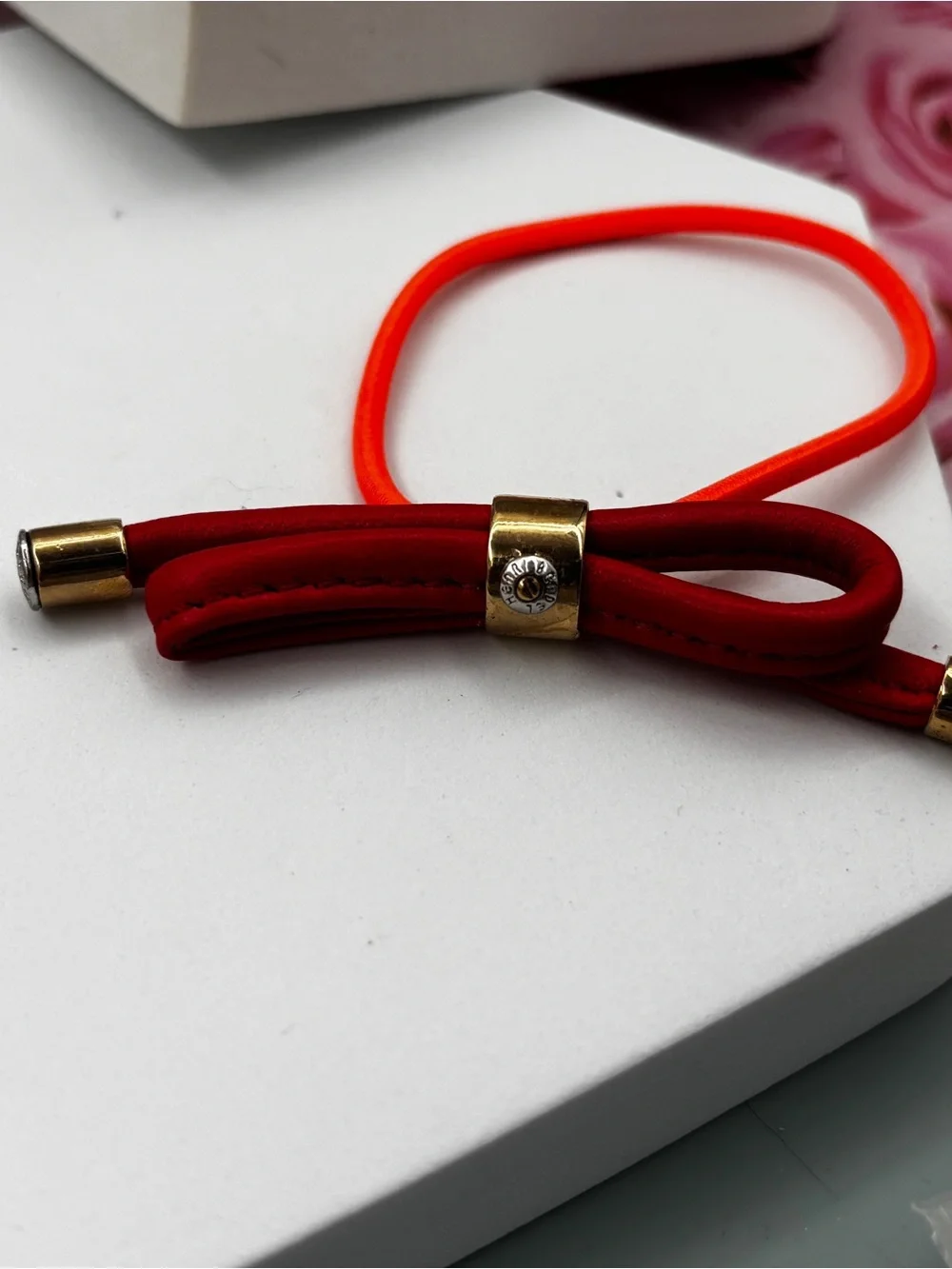 Henri Bendel Gold Tone leather bow Iconic Signed Hair Tie Pony-tail Holder